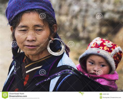 Hmong Woman Carrying Child And Wearing Traditional Attire, Sapa ...