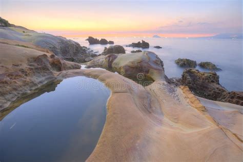 Scenery Of Sunrise By Rocky Coast In Northern Taiwan Stock Image