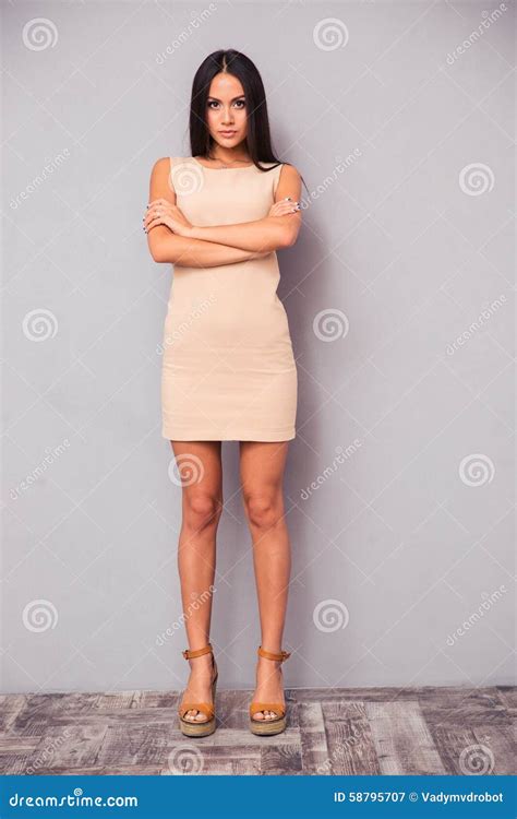 Full Length Portrait Of A Serious Woman With Arms Folded Stock Image Image Of Lady Brunette