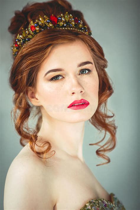 Beautiful Redhaired Fashion Model Posing In Evening Dress And In Stock