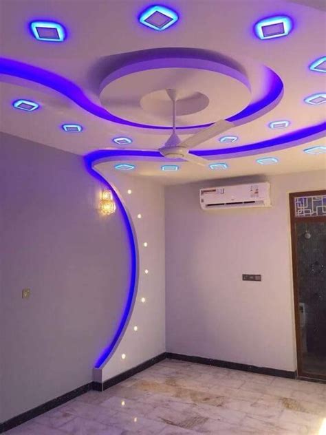 The Ceiling Is Decorated With Blue And White Lights Along With An