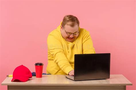 Cute Comic Man In Bright Casual Wear Working On Computer With Funny