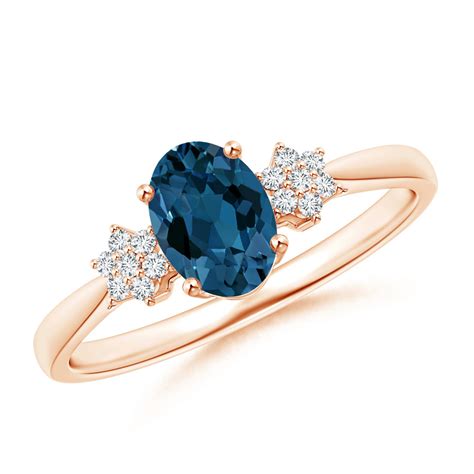 Oval London Blue Topaz Solitaire Ring With Diamond Clusters Angara