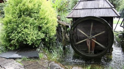 Old Water Mill Still Working Wooden Wheels Of Old Mill Are Rotating