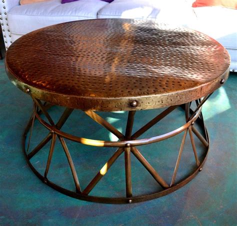 With its hammered metal base and wood top, this coffee table blends textures and hues to create an artisanal effect. Pin on Coffee Tables