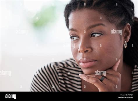 Black Woman Resting Chin In Hand Stock Photo Alamy