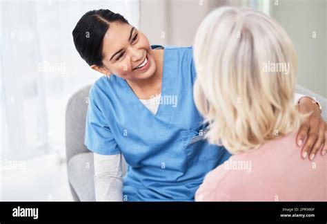 Im So Happy That Youre Feeling Better A Female Nurse Smiling While Talking To Her Patient Stock