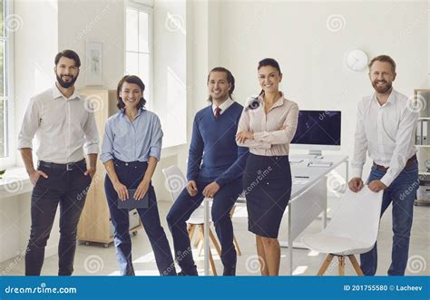 Ambitious Young Business Professionals Looking At Camera Ans Smiling