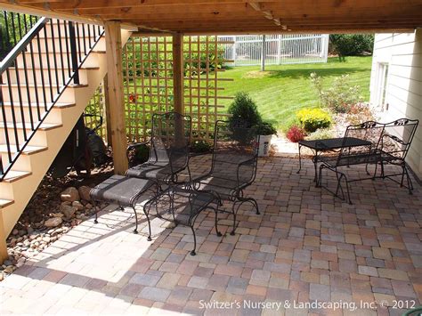 Paver Patio Under Deck With Retaining Wall And Steps Minnesota