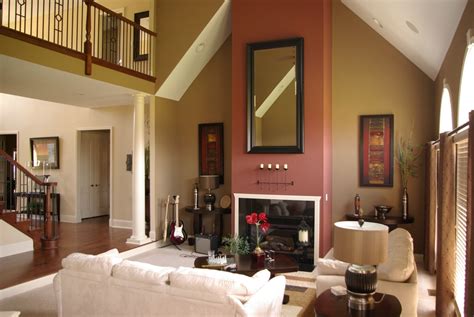 A contrasting bright wall paint color creates beautiful accent wall. Vaulted Ceiling Living Room Paint Color - Zion Star
