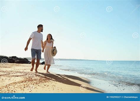 Happy Couple Running On Beach Near Sea Honeymoon Trip Stock Image Image Of Lovers Holding
