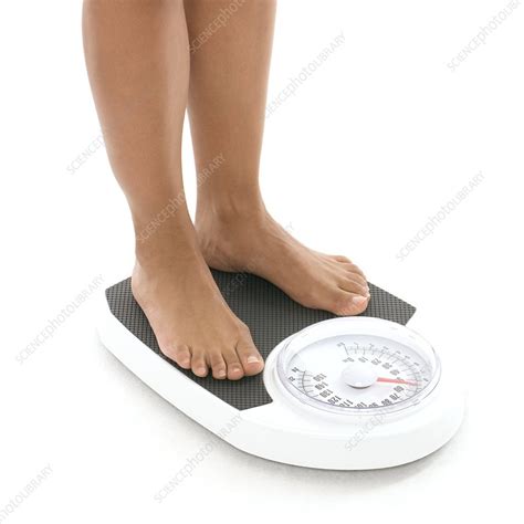 Woman Weighing Herself Stock Image F0028338 Science
