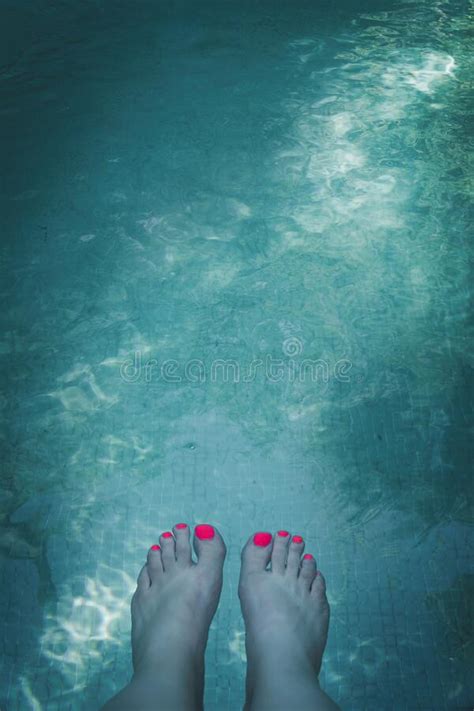 Womans Feet In Swimming Pool Of Bright Turquoise Blue Water Stock Photo Image Of Relaxation