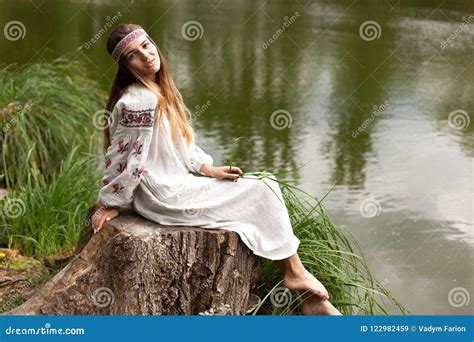 Steep Slender Ukrainian Woman Resting Sitting On A Stump On The Stock Image Image Of