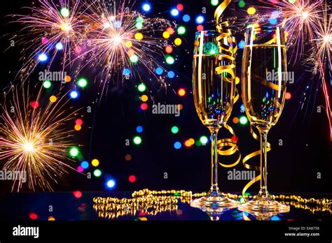Champagne Glasses With Fireworks On Background Stock Photo Alamy