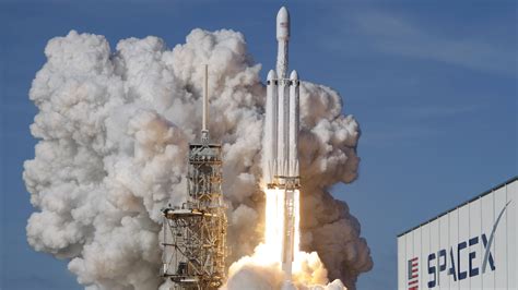 A spacex falcon 9 rocket with the company's crew dragon spacecraft onboard is seen on the launch pad at launch complex 39a as preparations . SpaceX Landed The Falcon Heavy's Two Boosters, But Its ...