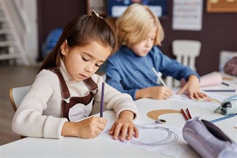 Selective Focus On Diligent Pretty Learner Of Primary School Drawing On