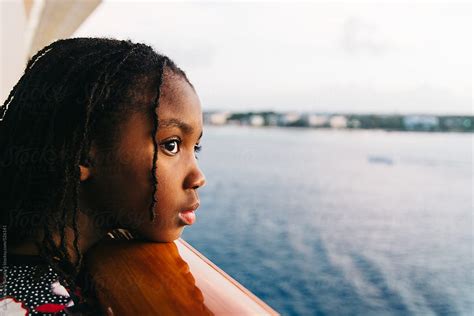 black girl watching the sea from a cruise ship balcony by stocksy contributor gabi bucataru