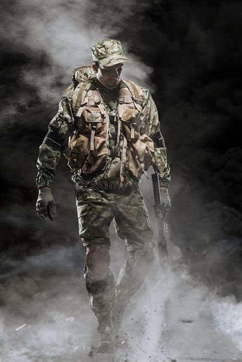 Special Forces Soldier Man Hold Machine Gun On A Dark Background Stock