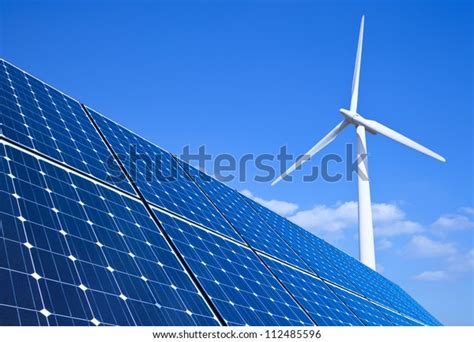 Solar Panels Wind Turbine Against Blue Stock Photo Edit Now 112485596