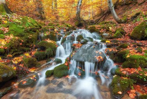 Beautiful Waterfall At Mountain River In Colorful Autumn