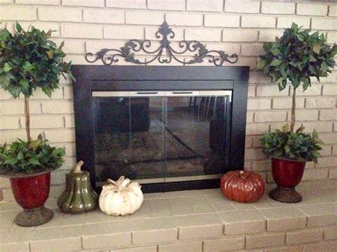 Once the tip of the the metal skin is not enough for an operable blind. Adding a metal "door topper" to fireplace adds interest ...