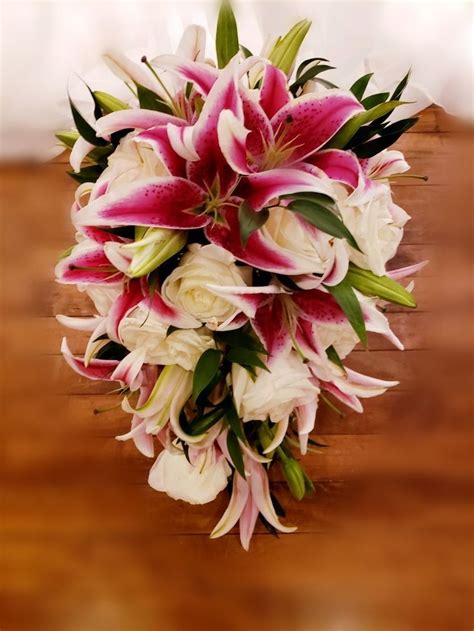 cascading pink tiger lilies and rose s wedding bouquet tiger lily wedding flowers blue