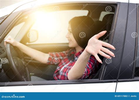 Woman Driving Car With Arm Out Of Window Stock Photo Image Of Casual
