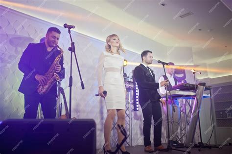 Free Photo Musicial Music Live Band Performing On A Stage With
