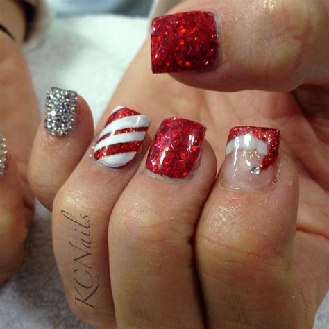 Christmas nails! Red & silver nails with rhinestone pinky ... The holiday season is a time.