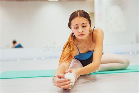 the girl is engaged in gymnastics doing stretching in the gym stock image image of engaged