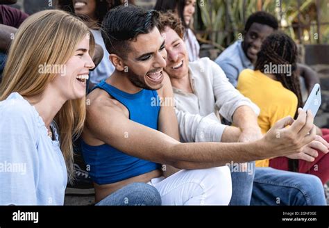 Young Multiracial Group Of Friends Taking Selfie With Mobile Smartphone