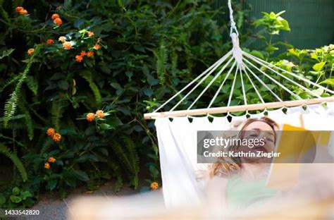 mature woman sunbathing garden photos and premium high res pictures getty images