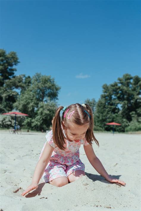Little Cute Girl On Beach Little Girl Playing In The Sand Stock Image