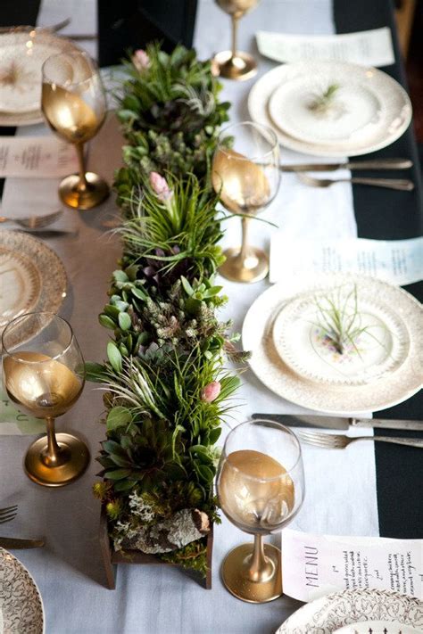 Modern dining room table with simple but stylish wooden chairs, a vase of flowers and an elegant table setting. Pinterest Picks - Simple Thanksgiving Table Setting Ideas