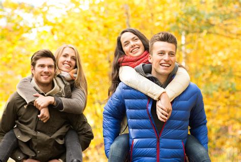 Group Of Friends Having Fun In Autumn Park Stock Photo Image Of