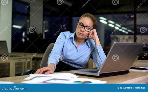 Upset And Tired Business Woman Sitting At Office Late At Night Troubles At Work Stock Photo