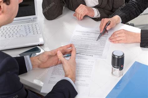 Hands Of Three People Signing Documents — Stock Photo © Iuriisokolov