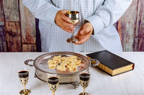 Premium Photo Holy Communion Cup Of Glass With Red Wine Bread Bible