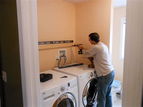 Here is how to build a wall mounted tv cabinet in just one day and hide i can't wait to show it to you! Installing Wall Cabinets In Laundry Room | online information