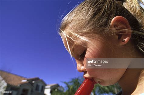 Young Girl Eating An Ice Pop Photo Getty Images
