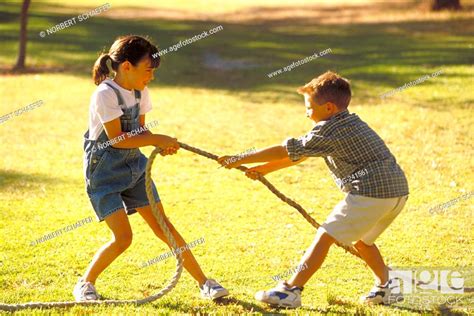 Park Scene Portrait Full Figure 8 Year Old Boy And Girl In The Same
