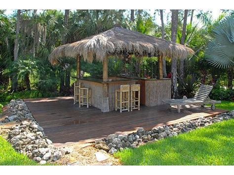 Sit back at our bar, relax, play some games, and enjoy the view of the boats going by. Tiki Bar in the backyard! like the rocks surrounding the ...