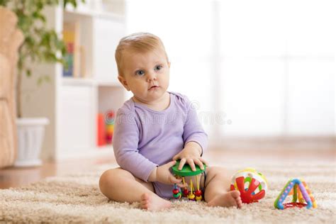 Cute Baby Playing Educationa Toys At Home Or Kindergarten Stock Photo