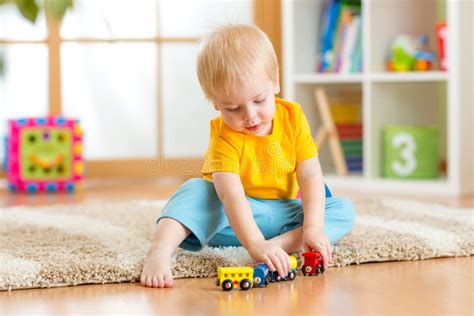 Child Boy Playing With Toys And Dog Stock Photo Image Of Happy