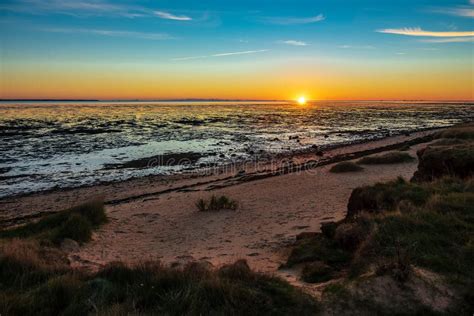 Sunrise On The North Sea Coast On The Island Amrum Germany Stock Image