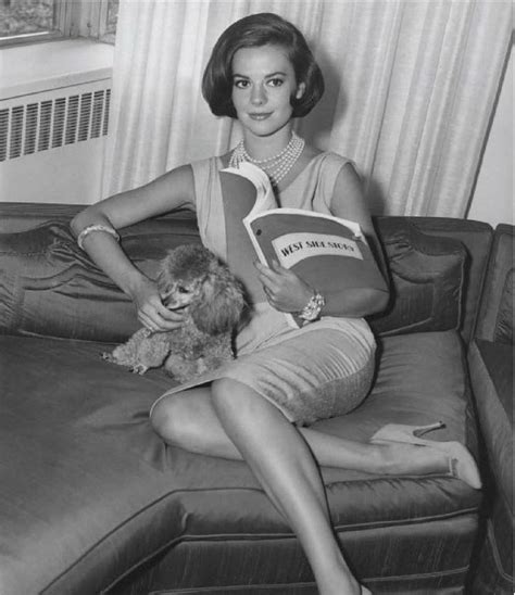 natalie and one of her poodles looking over the script for west side story 1961 blackandwhite