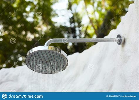 Outdoor Rain Shower Head Under Palm Trees And Sunny