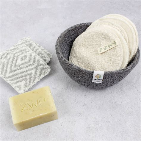 Serious woman showing clean and dirty cotton balls. large organic cotton facial pads pack of five by green ...