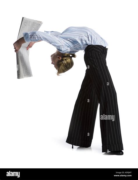 Female Contortionist Businesswoman Bending Over Backwards Stock Photo